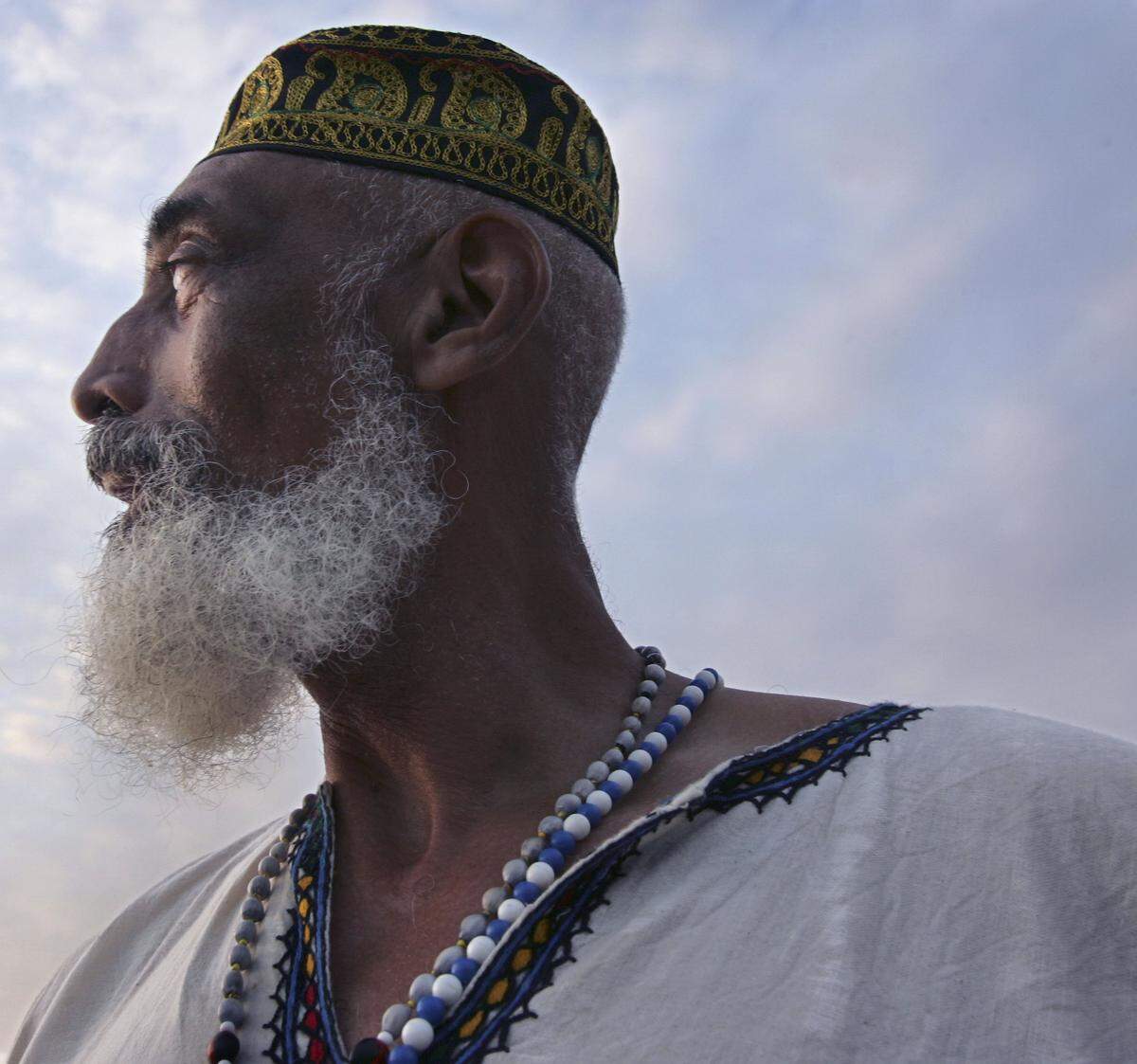 In this 2007 file photo, Gene Tinnie helps lead others in the Middle Passage ceremony. About 70 people gathered at a sunrise ceremony marking the ancestral remembrance of the Middle Passage, in which countless African slaves died en route to the Western Hemisphere.
