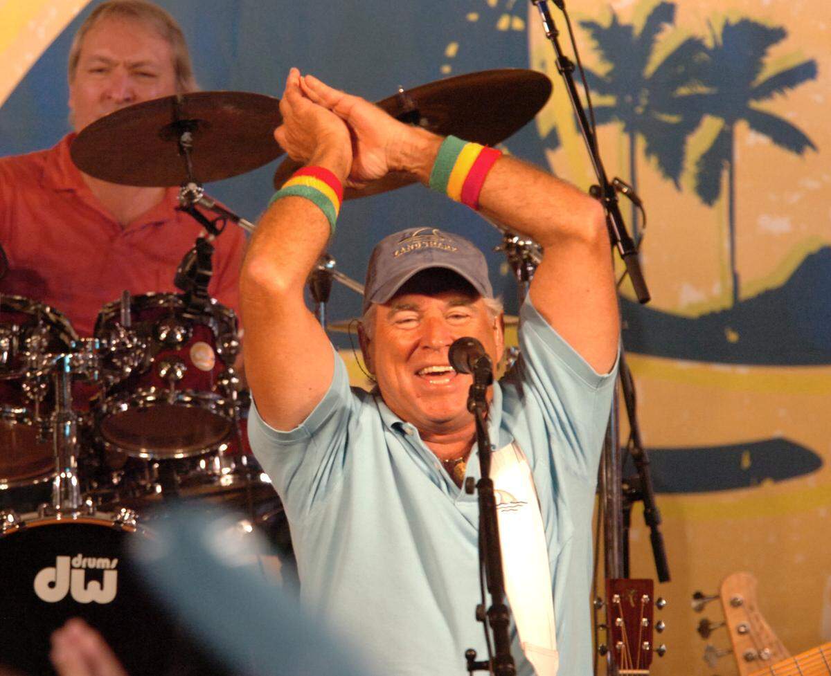 Jimmy Buffett sings his 1979 song “Fins” with new lyrics expressly written for the Dolphins football team and all Dolphin fans in South Florida, at a May 8, 2009, press conference held to announce that Dolphin Stadium was temporarily renamed LandShark Stadium in a licensing deal.