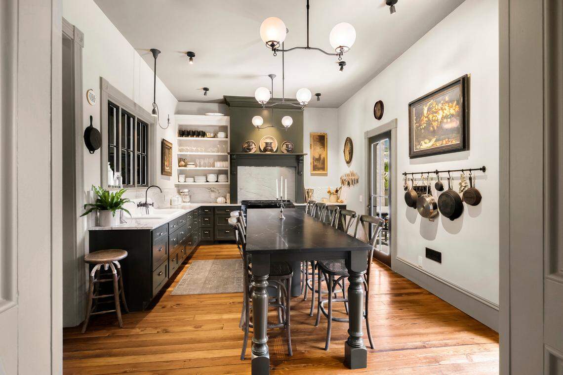 The home is bathed with natural light through floor-to-ceiling oversized windows, historic doors and elegant hardwood floors throughout, the listing on Compass says.