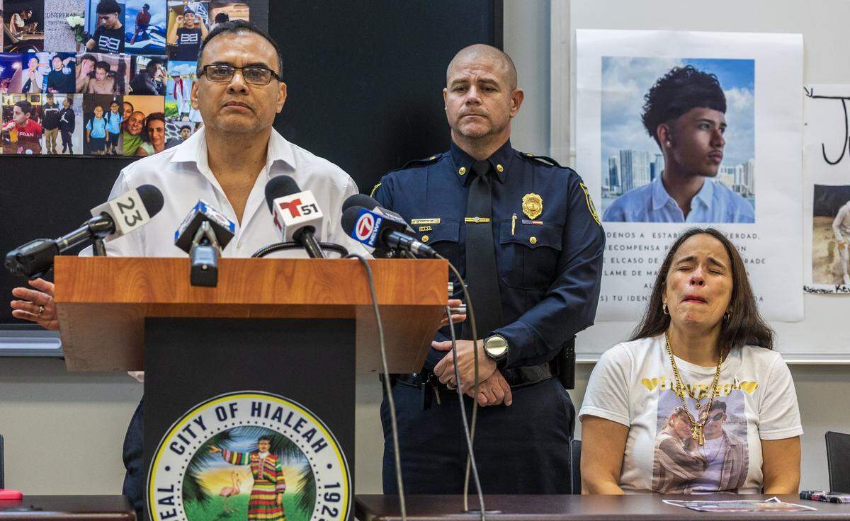 Lieutenant Eddie Rodriguez, with the Hialeah Police Department joined Orlando Ramirez and Victoria Jurado, the parents of Kevin Ramirez, during a public plea for Information in the Unsolved Homicides of Kevin and his friend Cristian Orlando Contreras, who were found shot to death inside an apartment in Hialeah last July, on Thursday November 20, 2025.