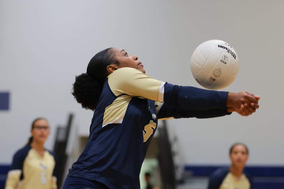 North Broward Prep defensive specialist Destiny Wiggins (5) hits the ball against Mater Lakes Academy during the first set of a Region 4-4A girls' volleyball regional final at North Broward Preparatory School in Coconut Creek, Florida, Wednesday, October 29, 2025.