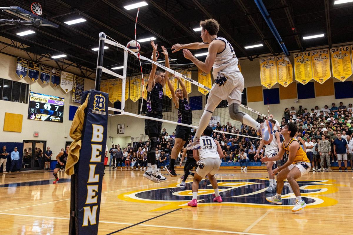 Belen Carlos Segrera (13) hits the antenna as he spikes the ball toward Southwest setter Jamel Toste (2) during the men’s volleyball regional final at Belen on Tuesday, May 14, 2024, in Miami, Fla.