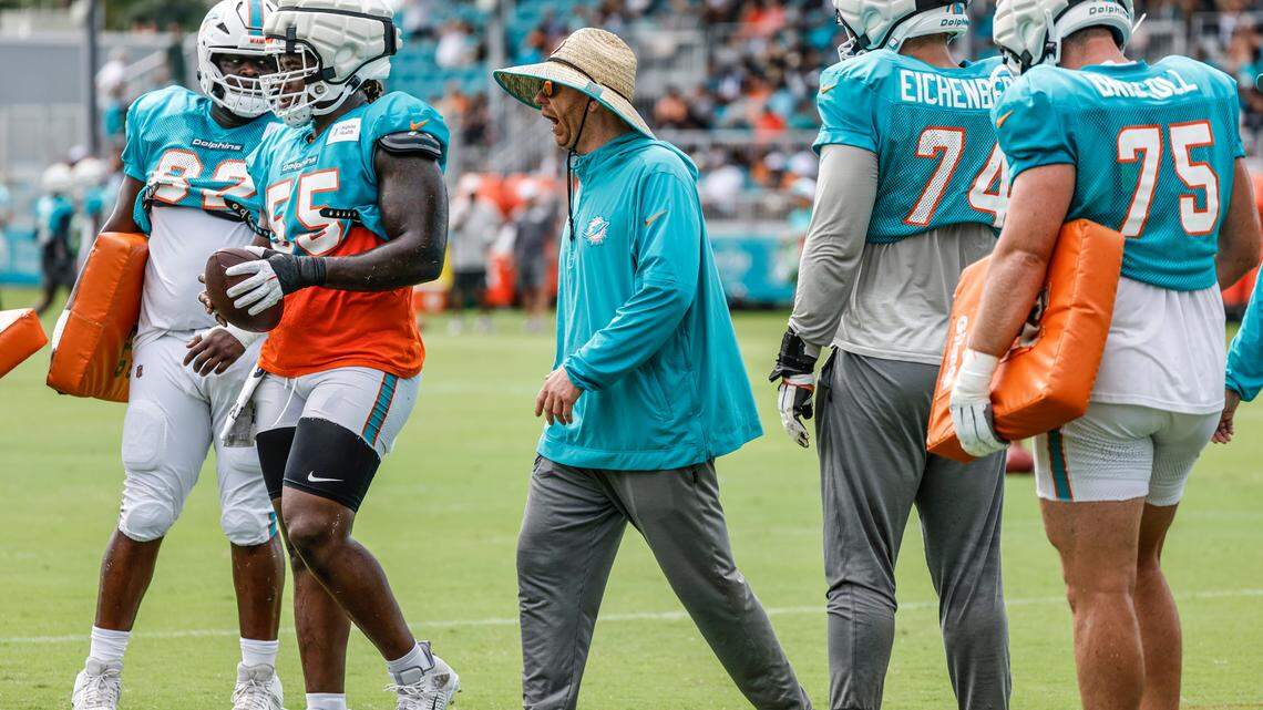 Miami Dolphins as offensive line coach Butch Barry works with players before a joint practice with the Atlanta Falcons at Baptist Health Training Complex in Miami Gardens, Florida, on Wednesday, August 7, 2024.