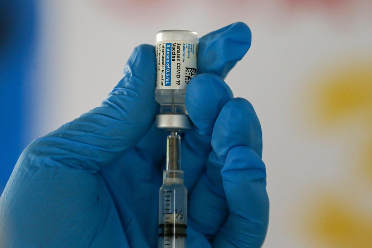 A healthcare worker fills a syringe with a vial of the J&J Covid-19 vaccine at the Town of Golden Beach, Florida, as the town received an allocation of 150 to 200 doses of J&J vaccines from the state, Friday, April 9, 2021.