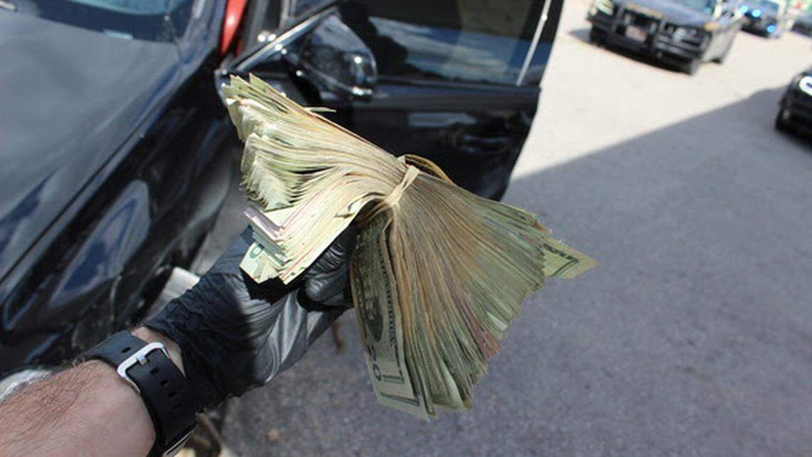 During a search of the crashed BMW, more than $10,000 in cash was found on the floorboard, Florida troopers say.