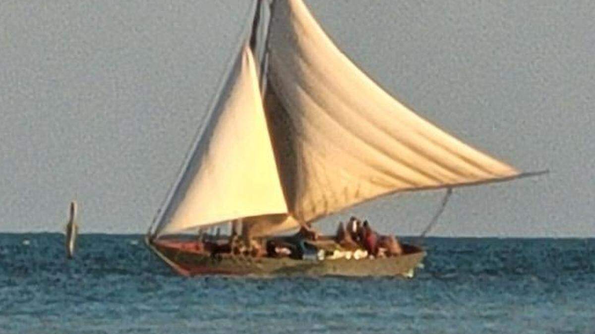 A Haitian migrant boat floats just off shore of the Middle Florida Keys city of Marathon Monday, Aug. 8, 2022. The Border Patrol said it took 109 people into custody from the vessel.