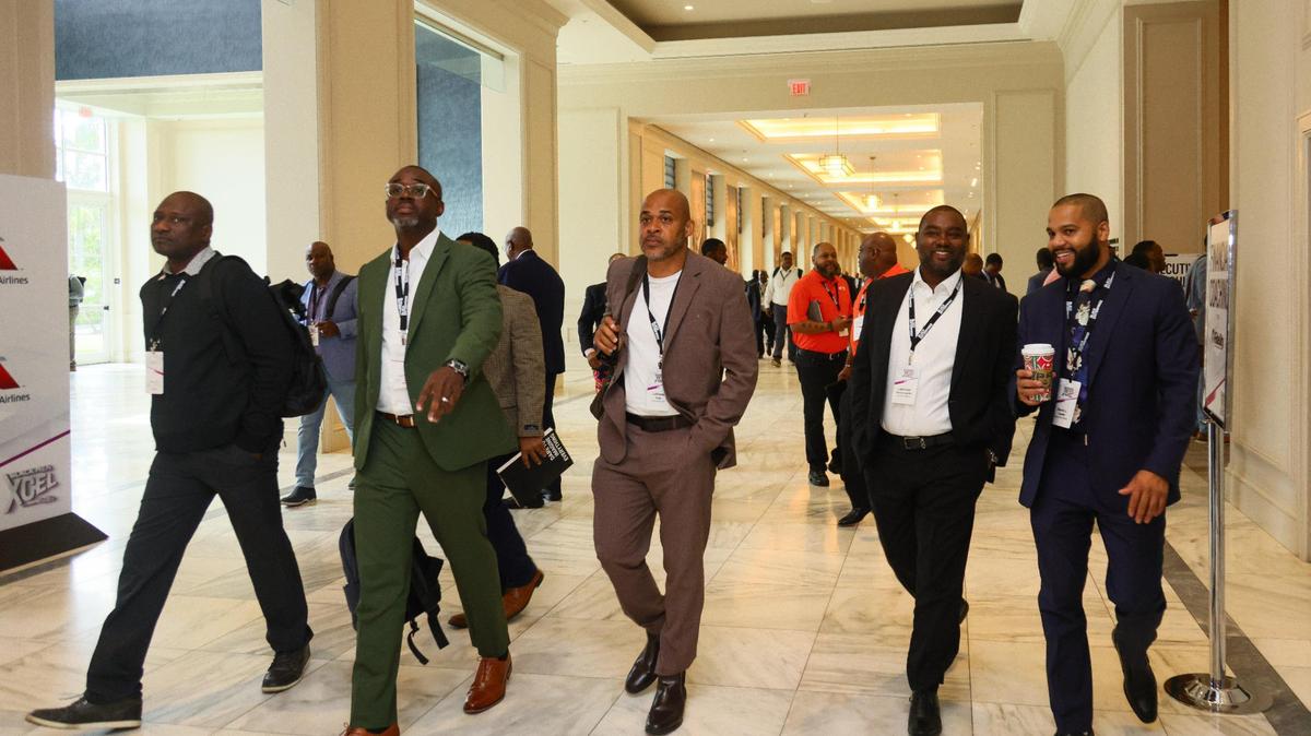Conference goers attend the Black Men XCEL Summit at the JW Marriott Miami Turnberry Resort & Spa in Aventura, Florida, on Thursday, November 7, 2024.