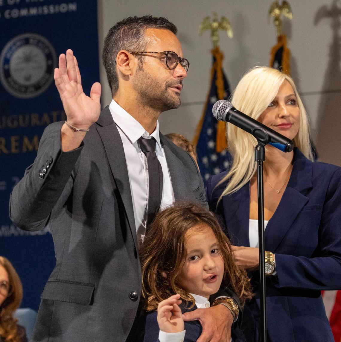David Suarez is sworn into office with his family by his side during a ceremony at the Miami Beach Convention Center on Nov. 28, 2023.