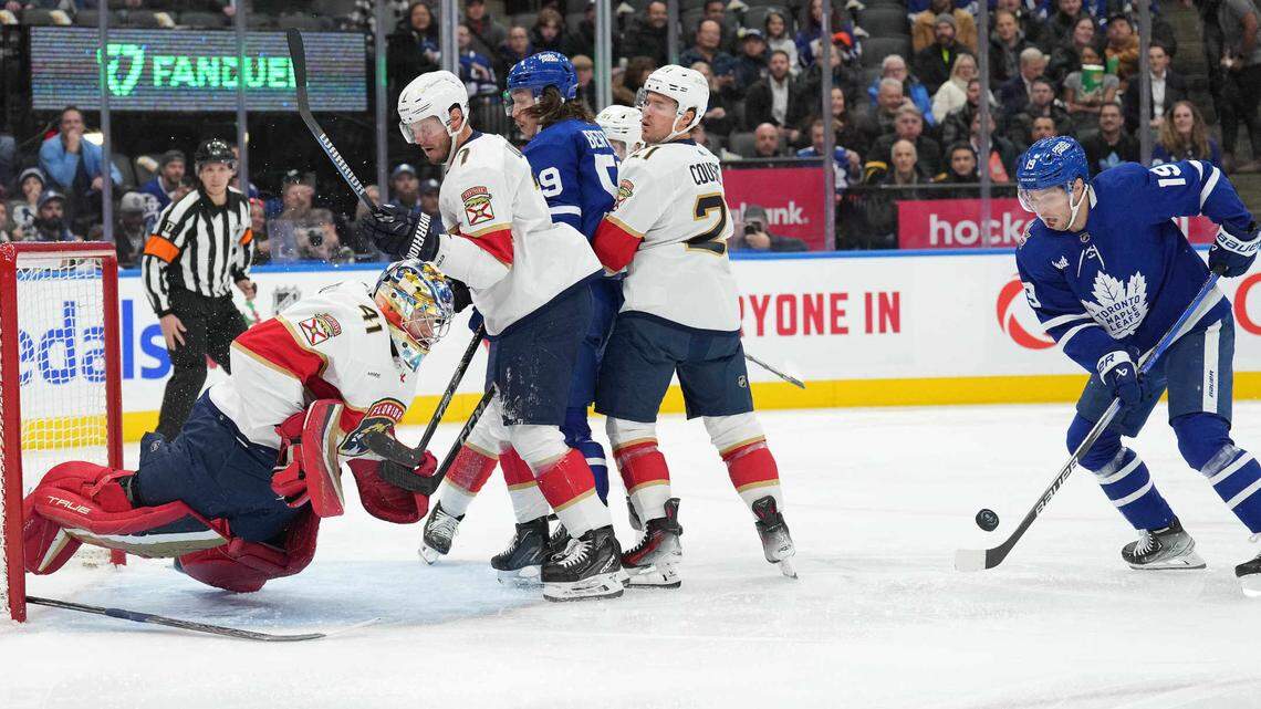 Nov 28, 2023; Toronto, Ontario, CAN; Toronto Maple Leafs center Calle Jarnkrok (19) battles for the puck in front of Florida Panthers goaltender Anthony Stolarz (41) during the first period at Scotiabank Arena.