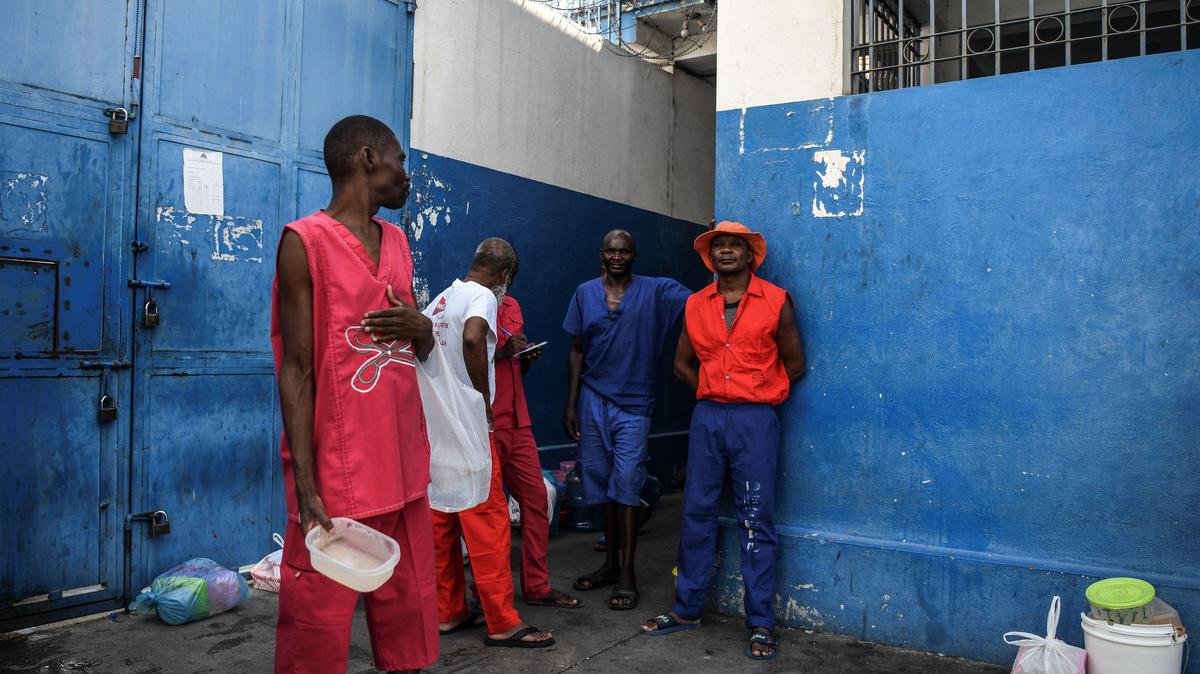 Prison inmates wait for food as they stand inside Haiti’s National Penitentiary in Port-au-Prince, on Aug. 30, 2019. The political crisis that has paralyzed Haiti since late August has had extreme consequences for prisoners, the vast majority of whom have been waiting to be tried for months or even years.