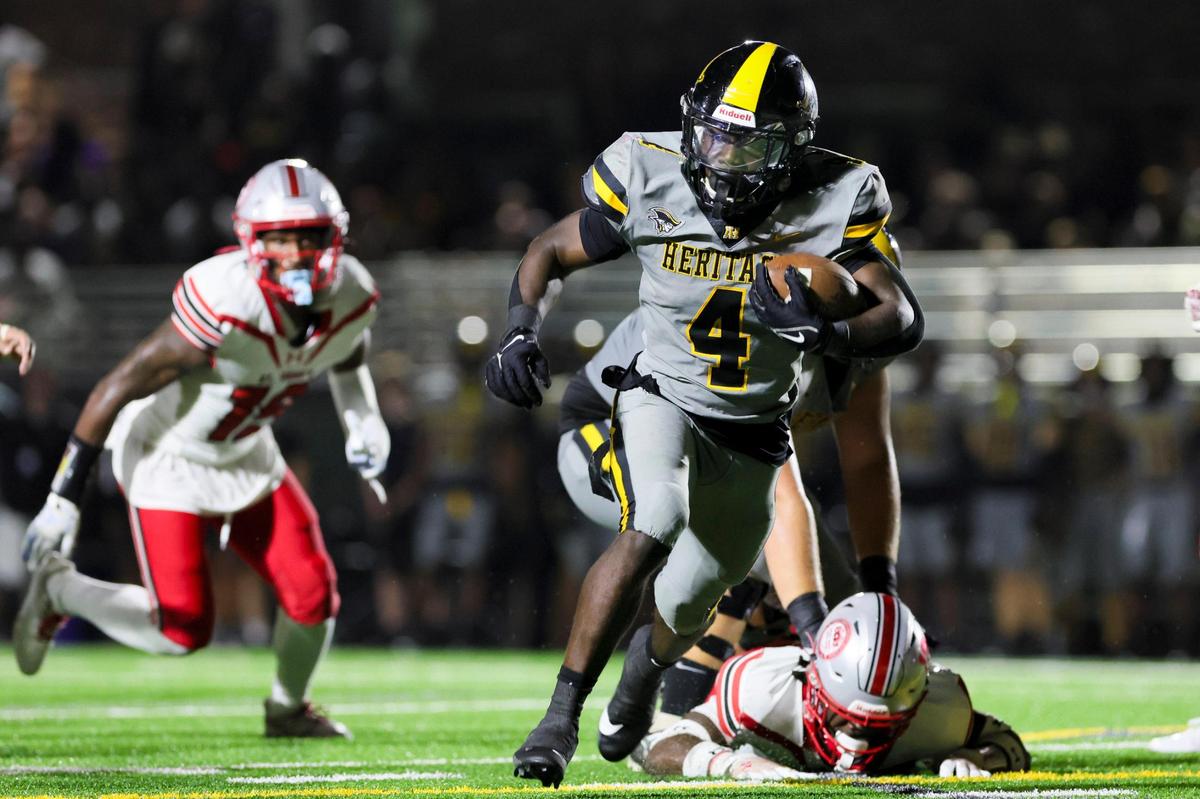 American Heritage running back Deandre Desinor (4) runs with the football for a touchdown against the St. John’s Cadets during the third quarter of a high school football game at American Heritage School in Plantation, Florida on Saturday, August 26, 2023.