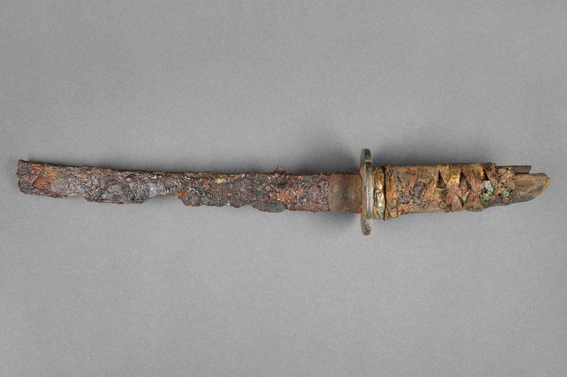 The sword was short and heavily corroded when it was pulled from the German cellar, archaeologists said.