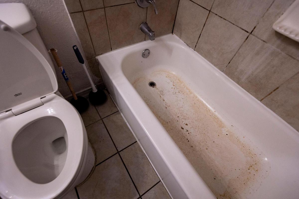 Raw sewage periodically overflows into Chaunquavia Manuel’s bathroom in her apartment at Glorieta Gardens.