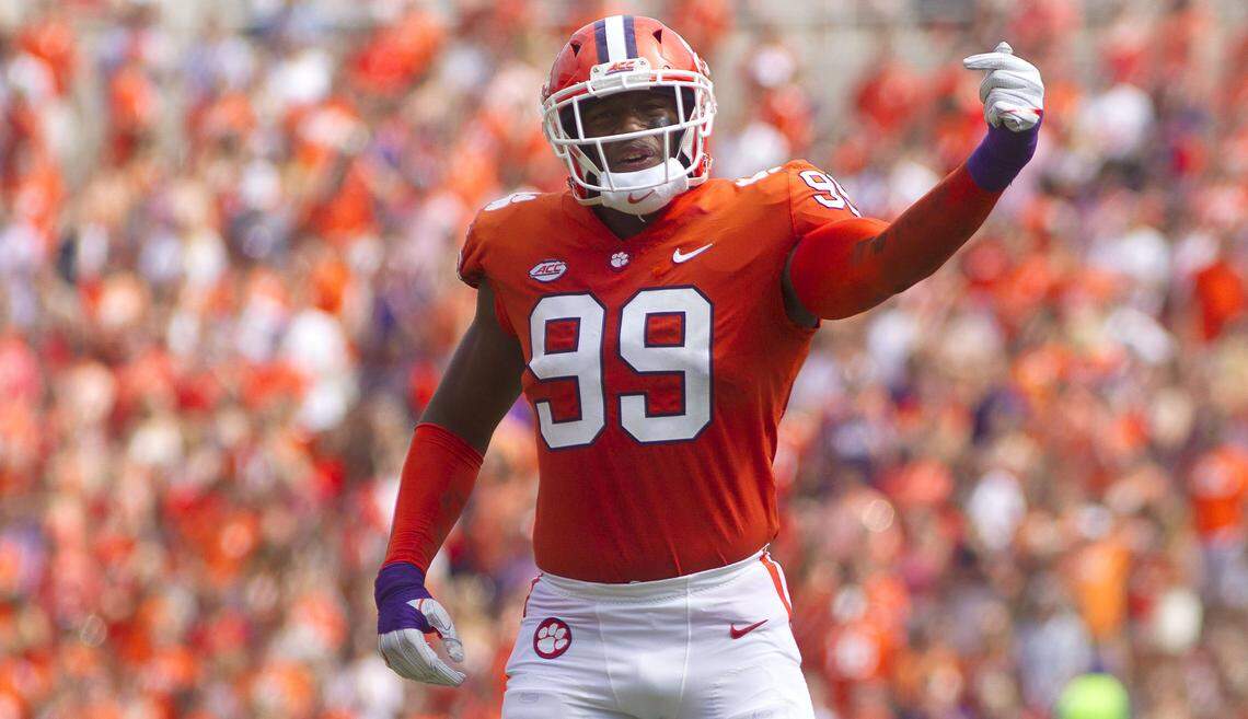 Clemson Tigers defensive end Clelin Ferrell (99) signals to the crowd between plays during the second half against the Syracuse Orange at Clemson Memorial Stadium.