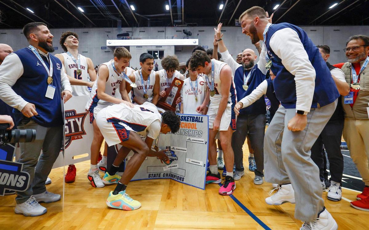 Columbus’ Jaxon Richardson (5) slap the team name onto the final bracket after Columbus defeats Windermere in the FHSAA Class 7A Final for Boys High School Basketball State Championship at the RP Funding Center in Lakeland, Florida on Saturday, March 8, 2025.