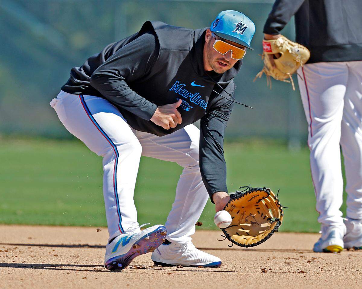 Miami Marlins first baseman Trey Mancini fields the ball during spring training at Roger Dean Chevrolet Stadium in Jupiter, Florida on Tuesday, February 20, 2024.