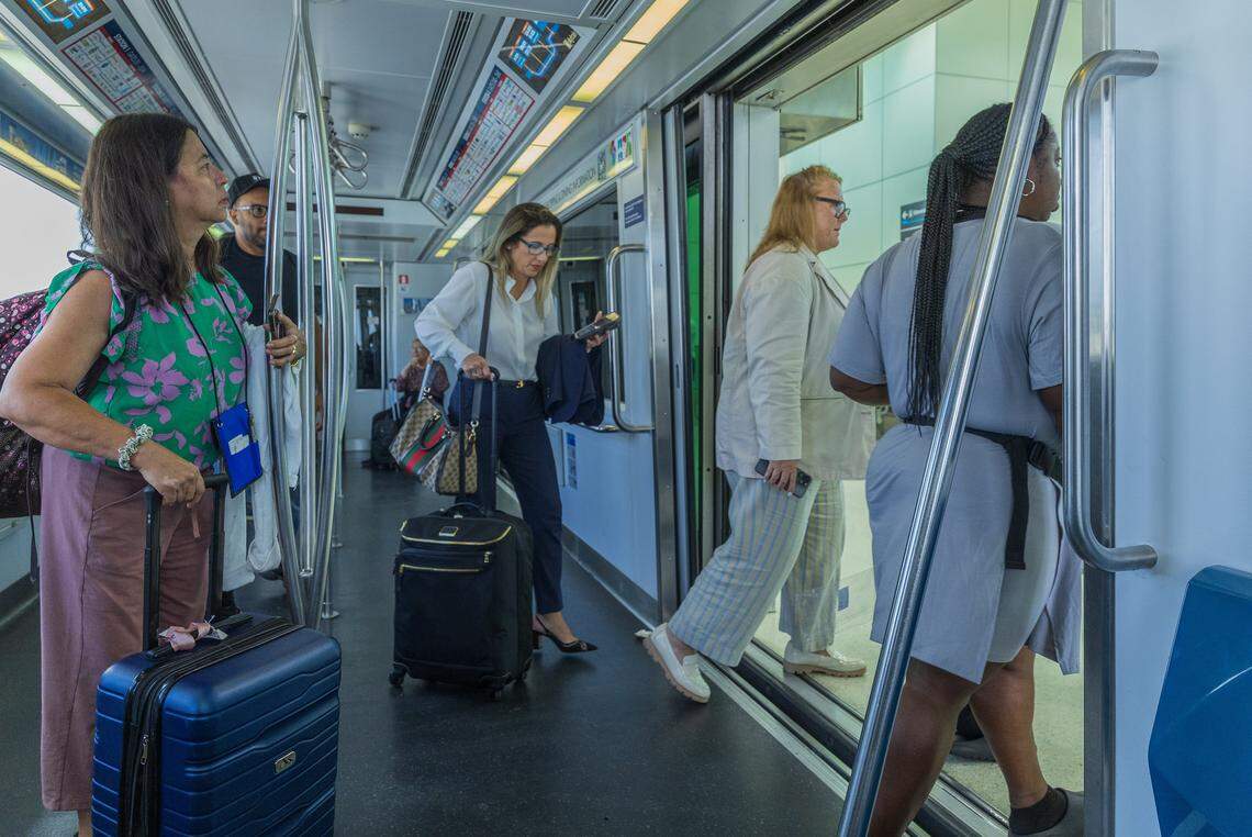 Passengers exit the MIA Skytrain at station 2, as the Skytrain system service is fully restored ahead of Labor Day weekend in Miami, on Thursday, August 28, 2025.
