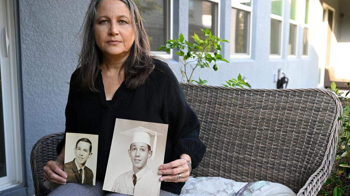 Angelea Barrett, at her home near Orlando, with photos of her late father, Warren Barrett. He was murdered at age 72 in a state-run mental hospital. The killer had been placed there under a state policy that ‘steps down’ patients with violent criminal histories into facilities not designed to house them.
