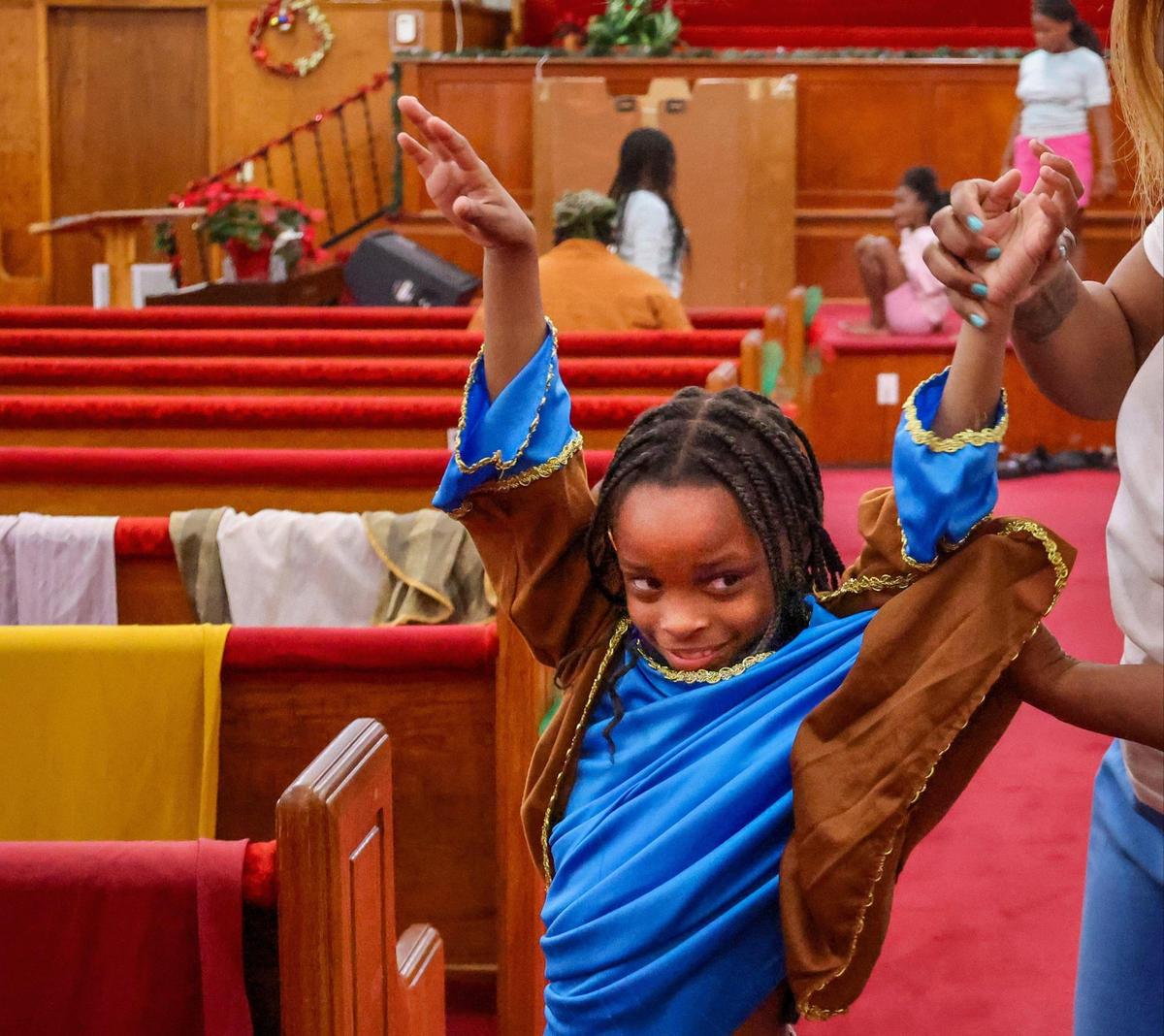 Raniya Benjamin, 8, tries on her costume for Christmas play at Macedonia Missionary Baptist Church. Miami’s first Black church, Macedonia Missionary is about to undergo an expansion in order to facilitate more programming to help the local children.