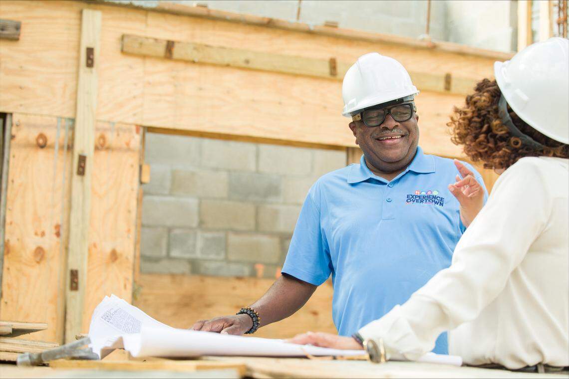 James McQueen, executive director of the Southeast Overtown/Park West Community Redevelopment Agency, speaks with Miami Commission Chairwoman Christine King, at right.