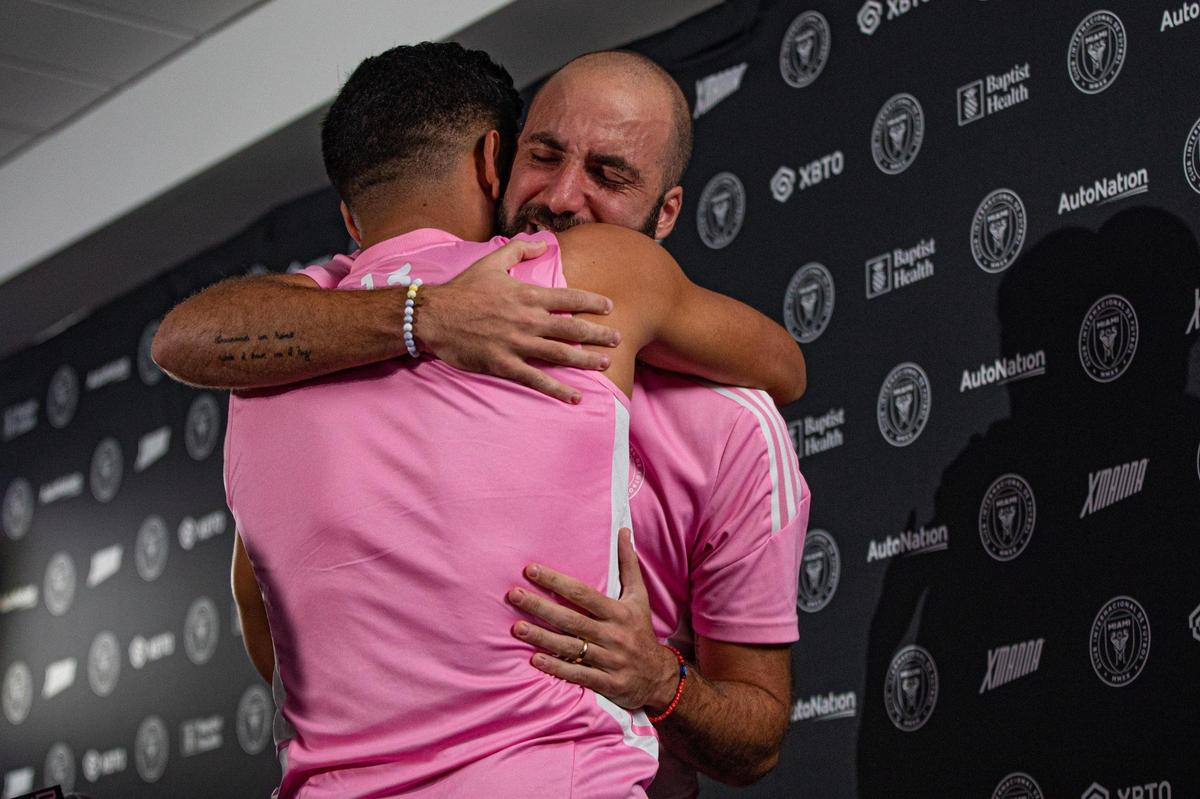 Inter Miami forward Gonzalo Higuaín (10) hugs his teammate after announcing his retirement during a press conference on Monday, October 3, 2022 at DRV PNK Stadium in Fort Lauderdale, Florida.