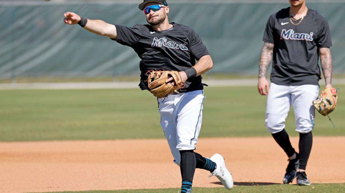Miami Marlins infielder Garrett Hampson goes through a fielding drill during spring training at Roger Dean Chevrolet Stadium in Jupiter, Florida on Tuesday, February 21, 2023.