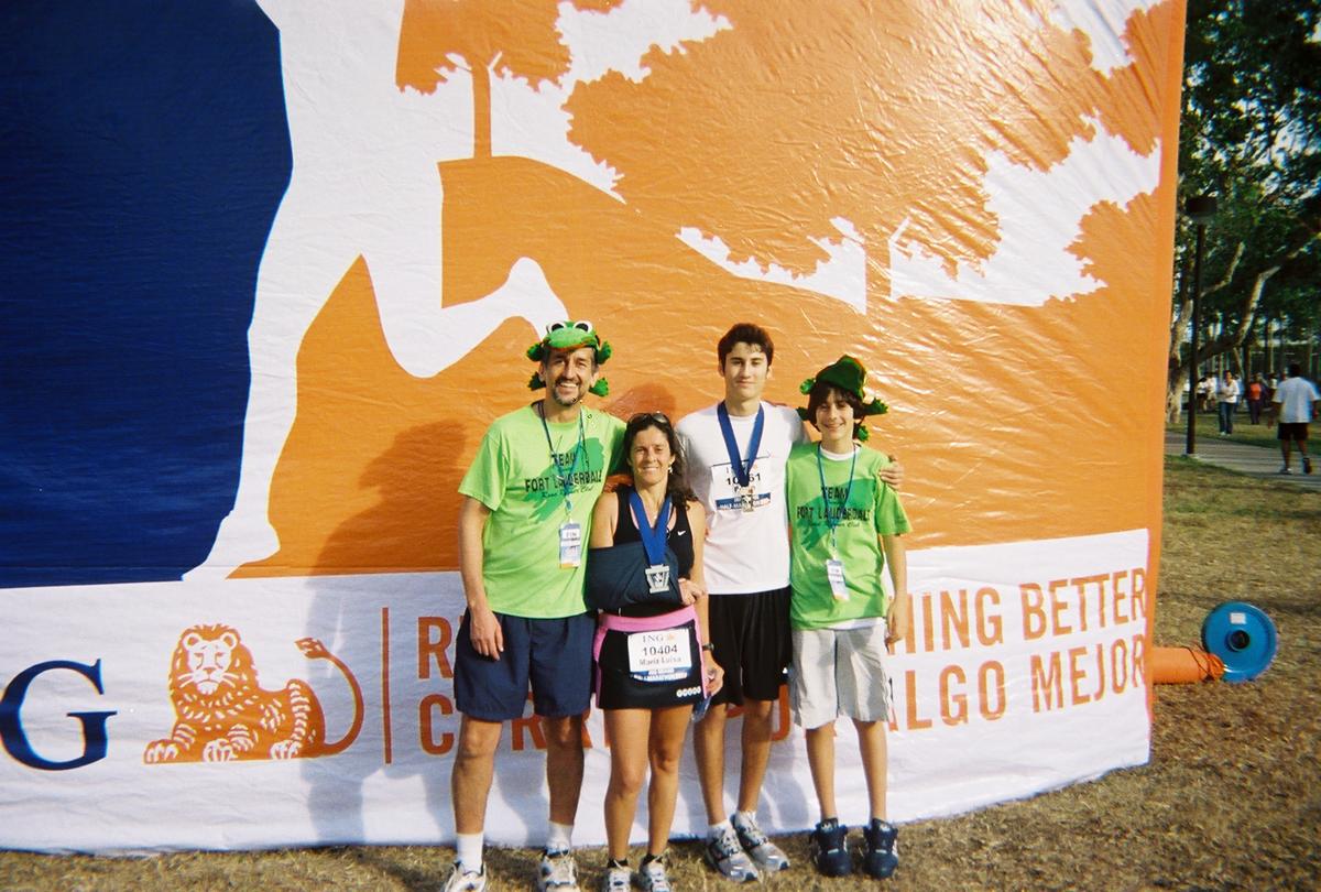 Maria Cesca ran the 2006 Miami Half Marathon wearing a sling on her injured shoulder. Her son Pedro Falci ran next to her. Her husband Piero and son Mateus were volunteers at the finish line.