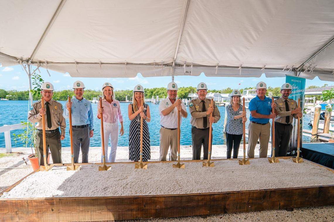 State and Monroe County officials pose with shovels and hardhats during a groundbreaking ceremony for a new discovery center and aquarium at John Pennekamp Coral Reef State Park in Key Largo Wednesday, April 22, 2026.
