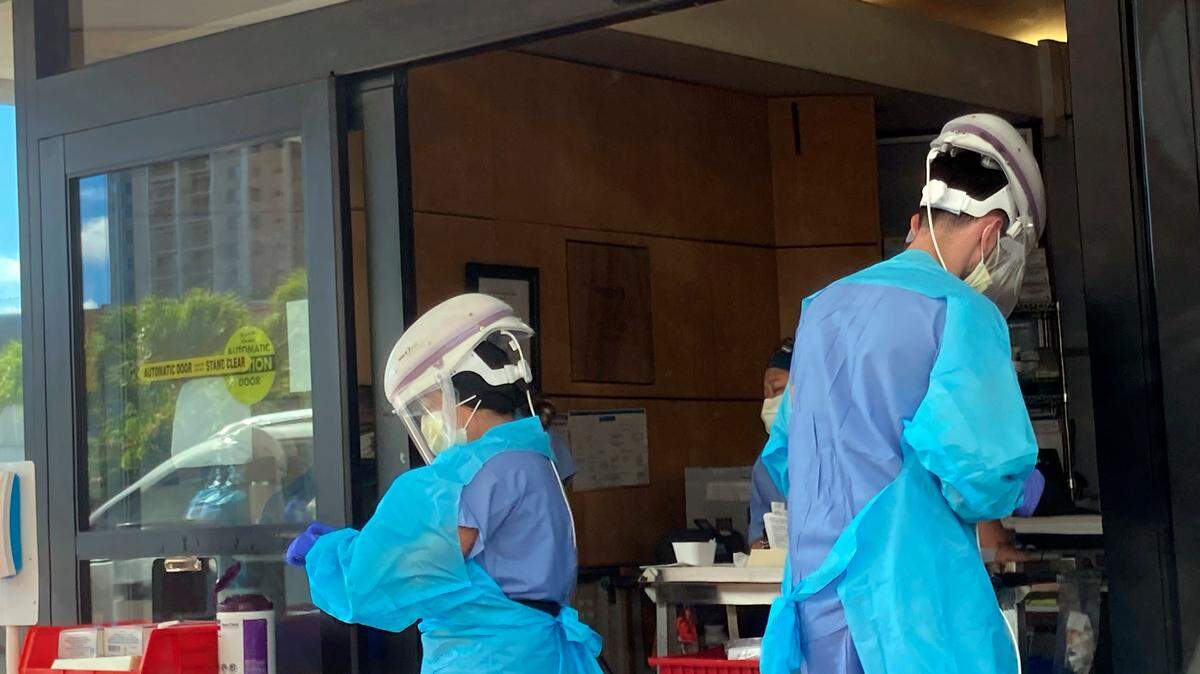 Hospital workers process COVID-19 tests at a hospital in Aiea, Hawaii, Wednesday, Sept. 15, 2021.