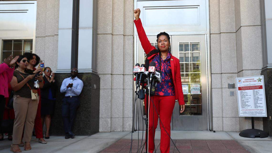Orange-Osceola State Attorney Monique Worrell, suspended by Gov. DeSantis, ends her press conference with a raised fist outside her former office in the Orange County Courthouse on Aug. 9.