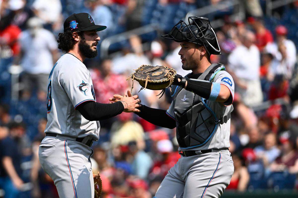 Jun 18, 2023; Washington, District of Columbia, USA; Miami Marlins relief pitcher Steven Okert (48) is congratulated by catcher Nick Fortes (4) after earring a save against the Washington Nationals at Nationals Park. Mandatory Credit: Brad Mills-USA TODAY Sports