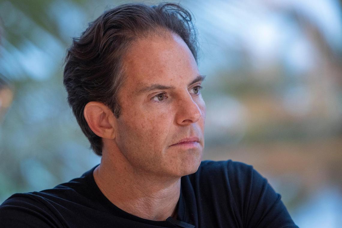 Developer Michael Shvo talking at the sales center pavilion he built behind the famous Miami Beach Art Deco Raleigh Hotel. Shvo is restoring the historic Raleigh along with a pair of smaller abutting hotels, behind which he plans to build a new luxury condo tower.