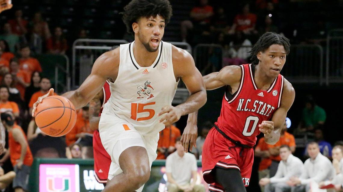UM Hurricanes forward Norchad Omier (15) drives to the basket during basketball game against NC State Wolfpack on Saturday, December 10, 2022 at Watsco Center in Coral Gables. Andrew Uloza / for Miami Herald