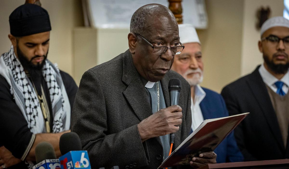 Sunrise, Florida, December 19, 2023 - Archdeacon Jean-Fritz Bazin of the Episcopal Dioceses of Florida speaks to members of the press and guest during a press conference held at the Islamic Foundation of Florida, 5455 NW 108th Ave, Sunrise, Florida. South Florida Faith Leaders representing the three Abrahamic faiths - Judaism, Christianity, and Islam - held a press conference demanding a cease fire in the Middle East.