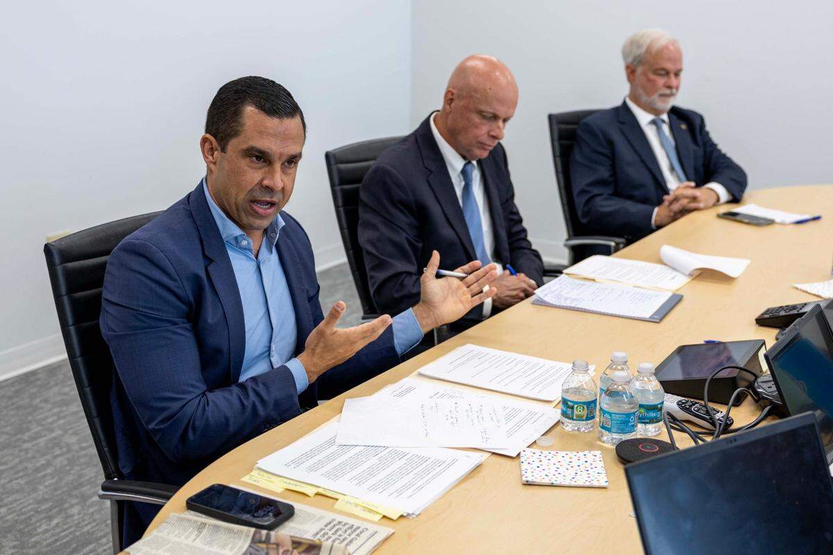 Vince Lago, left, speaks to the Miami Herald Editorial Board alongside his opposing candidates Michael Anthony Abbott, center, and Kirk R. Menendez, right, during an interview with the Coral Gables 2025 mayoral candidates at the Miami Herald newsroom on Thursday, March 6, 2025, in Miami, Florida.
