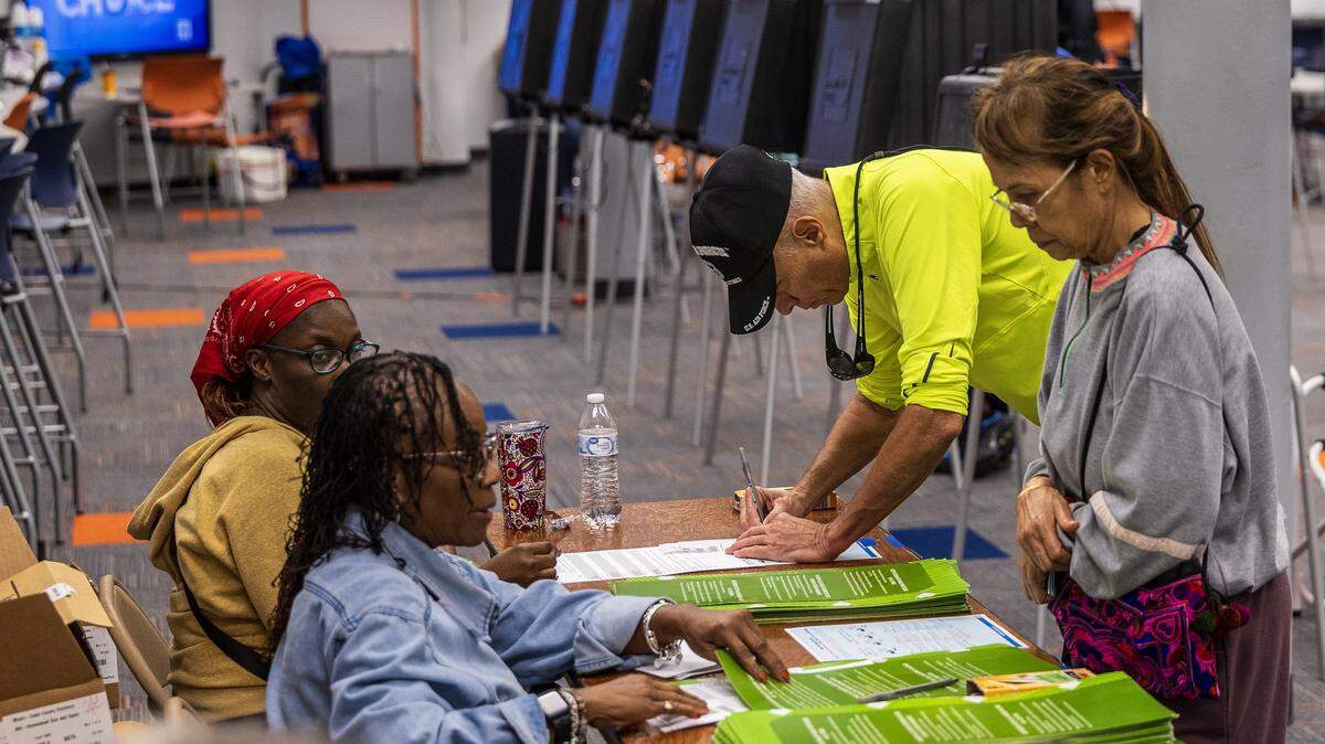 Homestead residents check in with poll workers during the Election Day on November 4, 2025 City of Homestead general municipal and special elections, at the Homestead Senior High School voting poll location.
