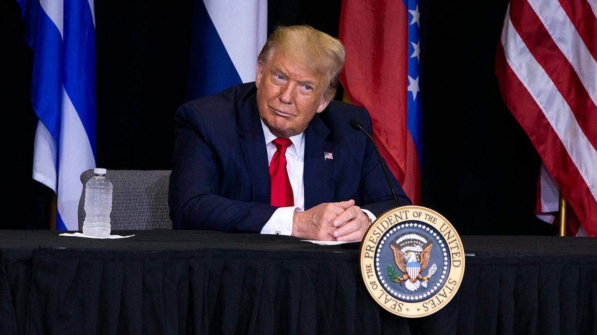 U.S President Donald J. Trump listens as a group of members from the Venezuelan and the Cuban Exile communities talk about the situation in their countries under socialists regimes during a meeting at Iglesia Doral Worship center Church in Doral after he visited he U.S. Southern Command, on Friday, July 10, 2020.