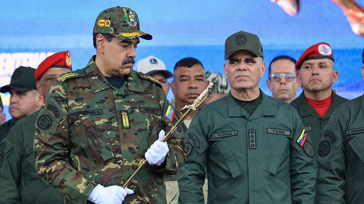 CARACAS, VENEZUELA - NOVEMBER 25: President of Venezuela NicolÃ(degrees)s Maduro holds the Venezuelan independence hero Simon Bolivar's 'Sword of Peru' alongside Minister of Defense Vladimir Padrino Lopez during a military ceremony commemorating the 200th anniversary of the presentation of the 'Sword of Peru' to Venezuelan independence hero SimÃ³n BolÃvar on November 25, 2025, in Caracas, Venezuela. The United States recently designated the "Cartel De Los Soles" (Cartel of The Suns) as a foreign terrorist organization, a group allegedly led by the president of Venezuela, Nicolas Maduro, and which, it is presumed, includes high-ranking members of the Venezuelan government. (Photo by Jesus Vargas/Getty Images)