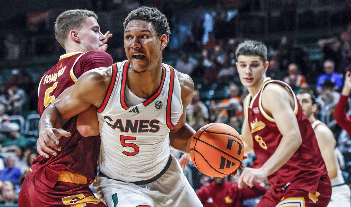 Miami Hurricanes forward Malik Reneau (5) drives the ball under the basket in the first half during their NCAA basketball game against the ULM Warhawks at Watsco Center, at the University of Miami campus in Coral Gables, Florida on Saturday, December 13, 2025.