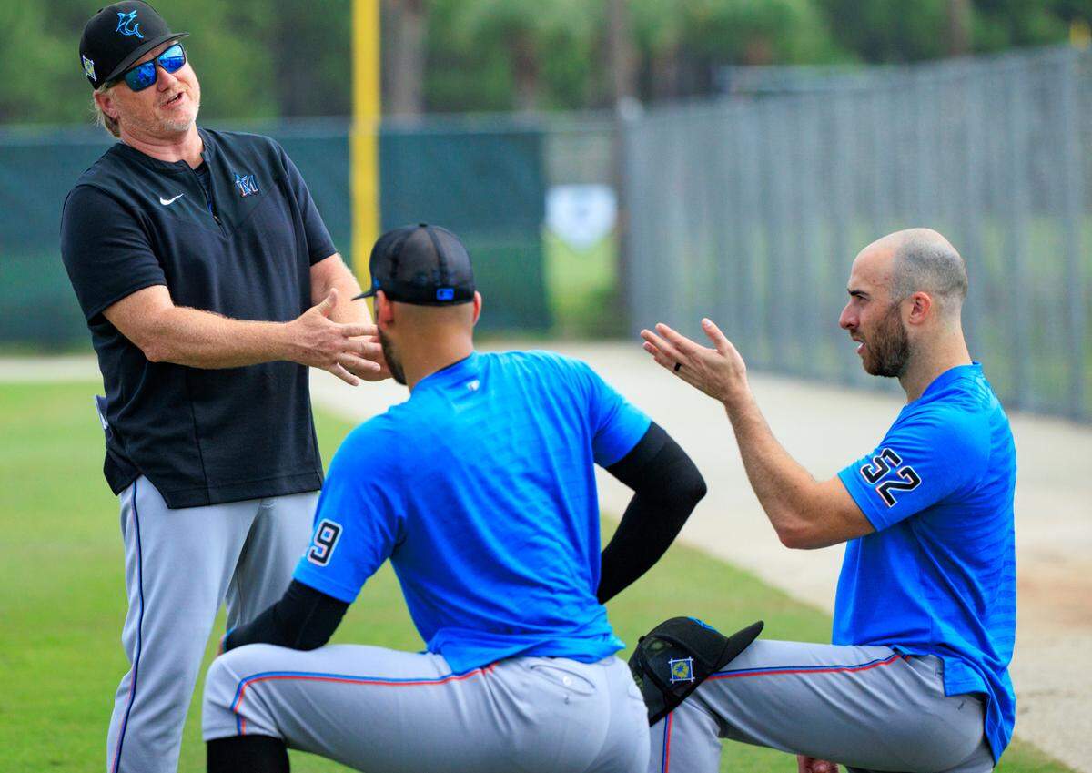 Miami Marlins pitching coach Mel Stottlemyre Jr talk with Marlins pitchers Anthony Bass (52) and Pablo Lopez during their spring training workout at Roger Dean Stadium on Thursday, March 17, 2022 in Jupiter, FL.