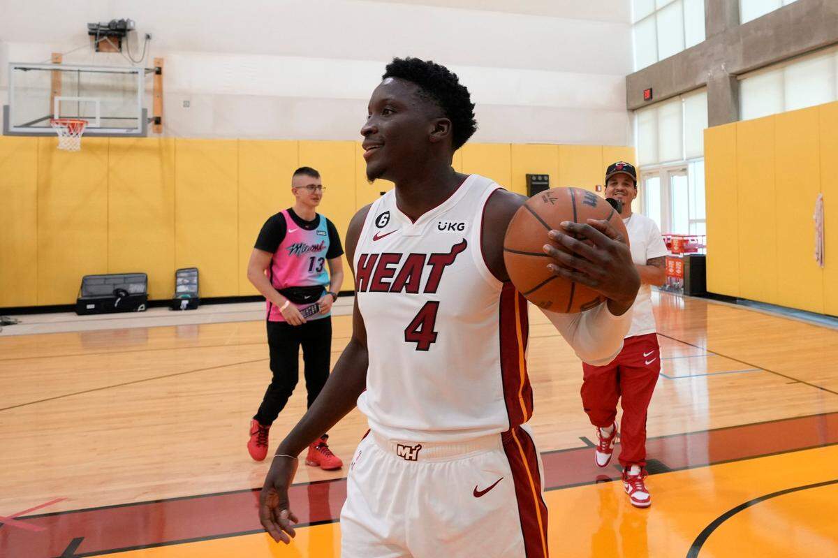 Miami Heat’s Victor Oladipo messes around with a basketball between portrait sessions, during the NBA basketball team’s Media Day in Miami, Monday, Sept. 26, 2022.
