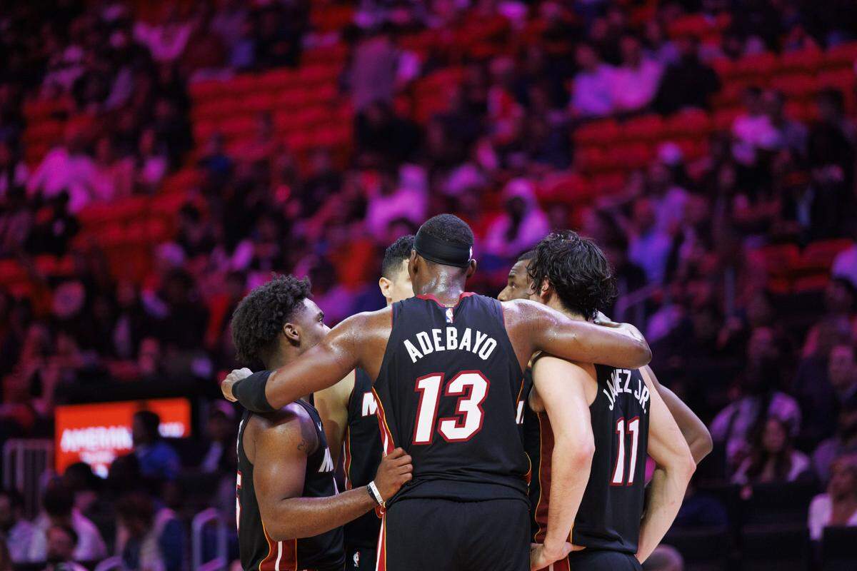 Miami Heat center Bam Adebayo (13) gathers his teammates for a huddle during the second half of a game against the Toronto Raptors on Dec. 15, 2025, at Kaseya Center in Miami.