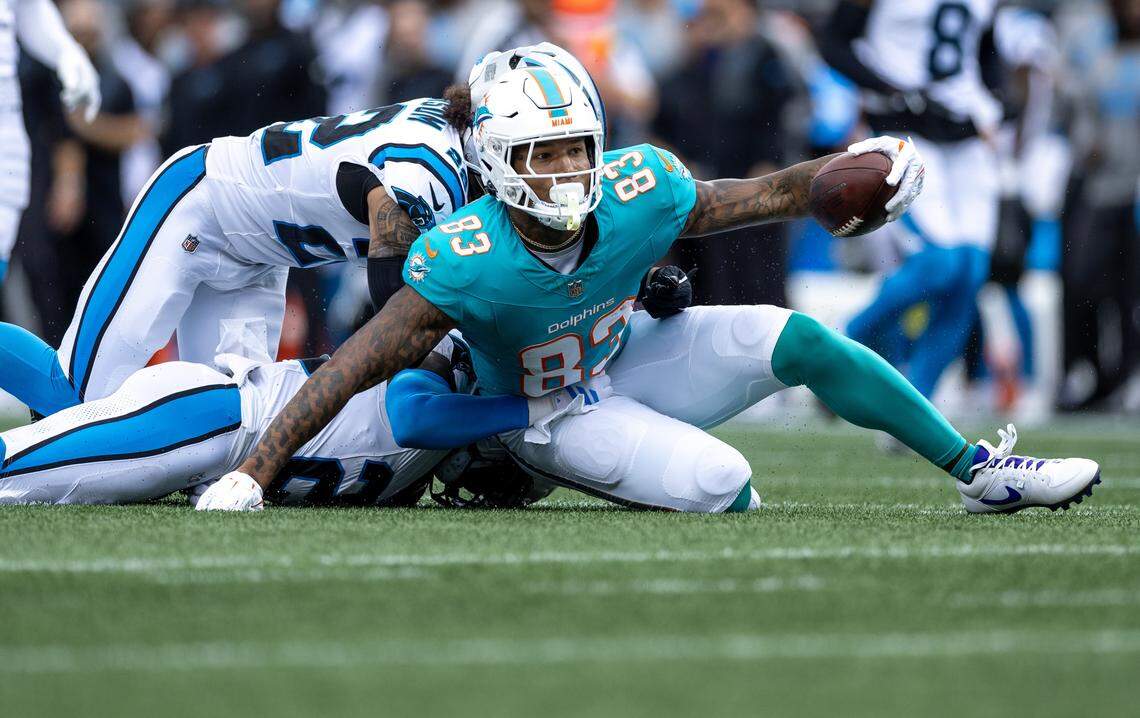 Miami Dolphins tight end Darren Waller (83) reacts after catching a pass during the first half of an NFL football game against the Carolina Panthers, Sunday, Oct. 5, 2025, in Charlotte, N.C.