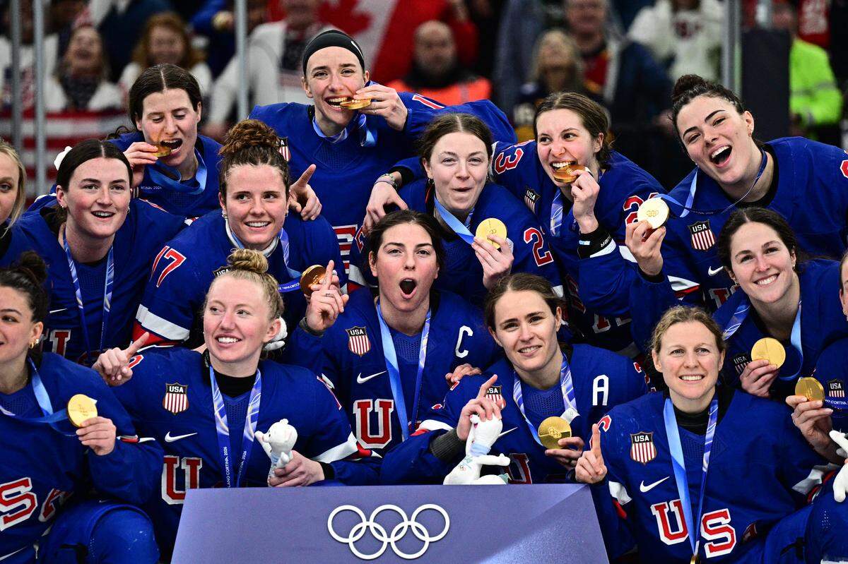 Gold medallists USA pose during the medals ceremony for the women's ice hockey event at the Milano Santagiulia Ice Hockey Arena during the Milano Cortina 2026 Winter Olympic Games in Milan, on February 19, 2026. (Photo by JULIEN DE ROSA / AFP via Getty Images)