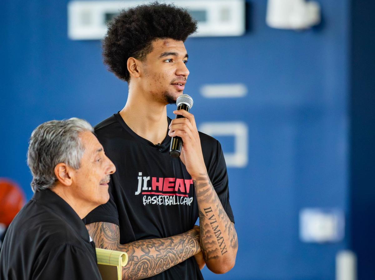 Miami Heat player Kel’el Ware answers a question from a kid at the Jr. HEAT Basketball Camp kids at SLAM Miami charter school on Thursday, July 25, 2024 in Miami, Fla.