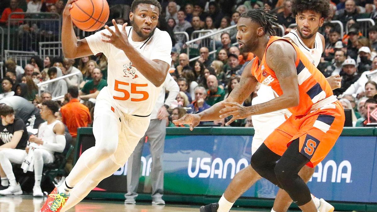 UM Hurricanes Wooga Poplar (55) controls the ball during NCAA men’s basketball game agains Syracuse on Monday, January 16, 2023 at Watsco Center in Coral Gables. Andrew Uloza / for Miami Herald
