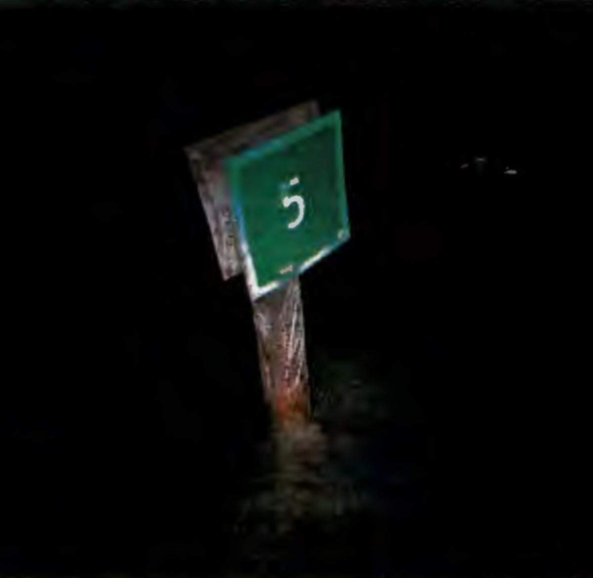 A photograph shows Daybeacon 5, a fixed navigational aid in a channel off Key West that was struck by a boat on Oct. 6, 2023.