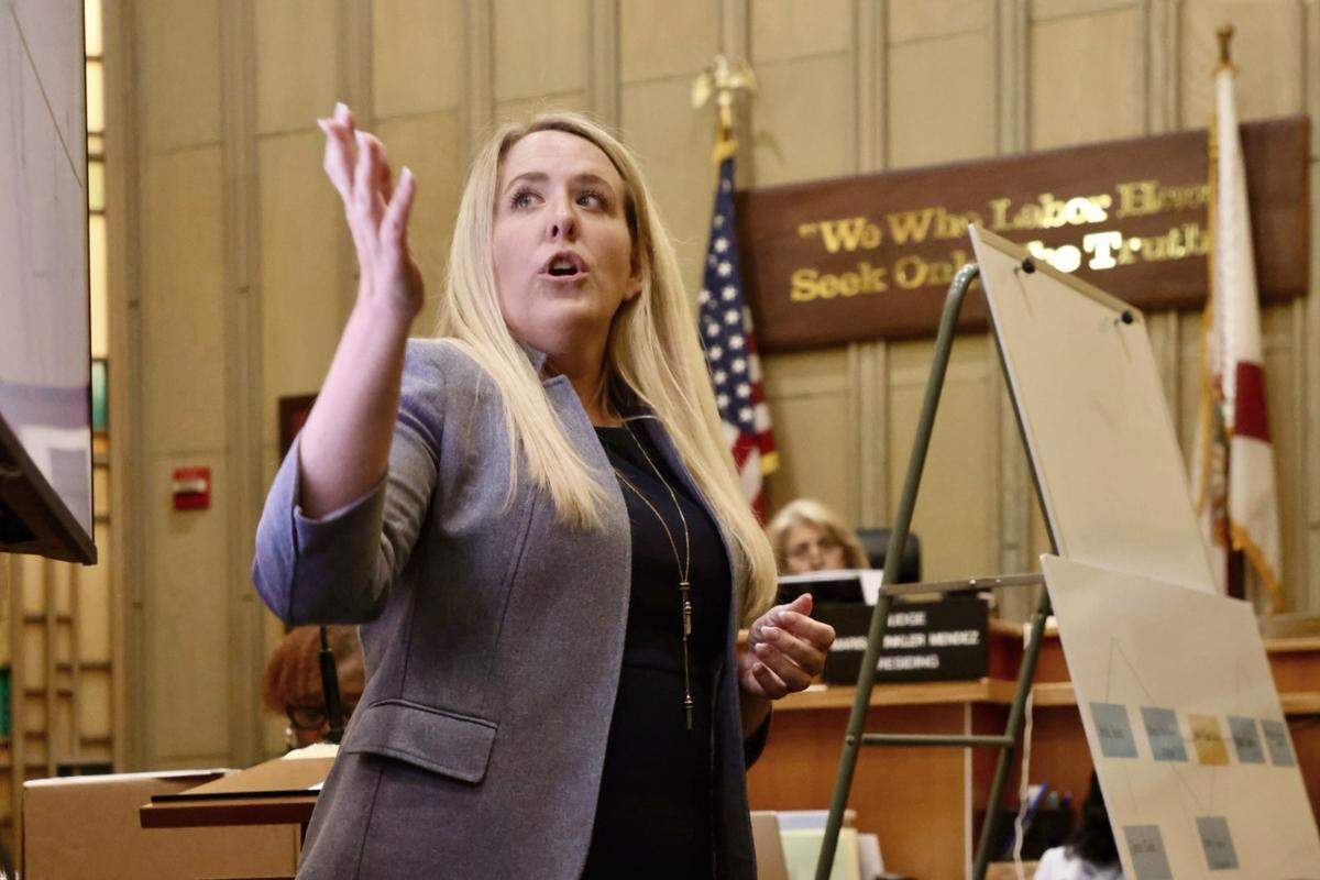 Assistant State Attorney Bronwyn Nayci gives the closing argument during the sexual battery trial of the MDSO Officer Daniel Ramos-Aviles, far left, while sitting with his attorneys on Wednesday, September 3, 2025, in Miami, Florida.