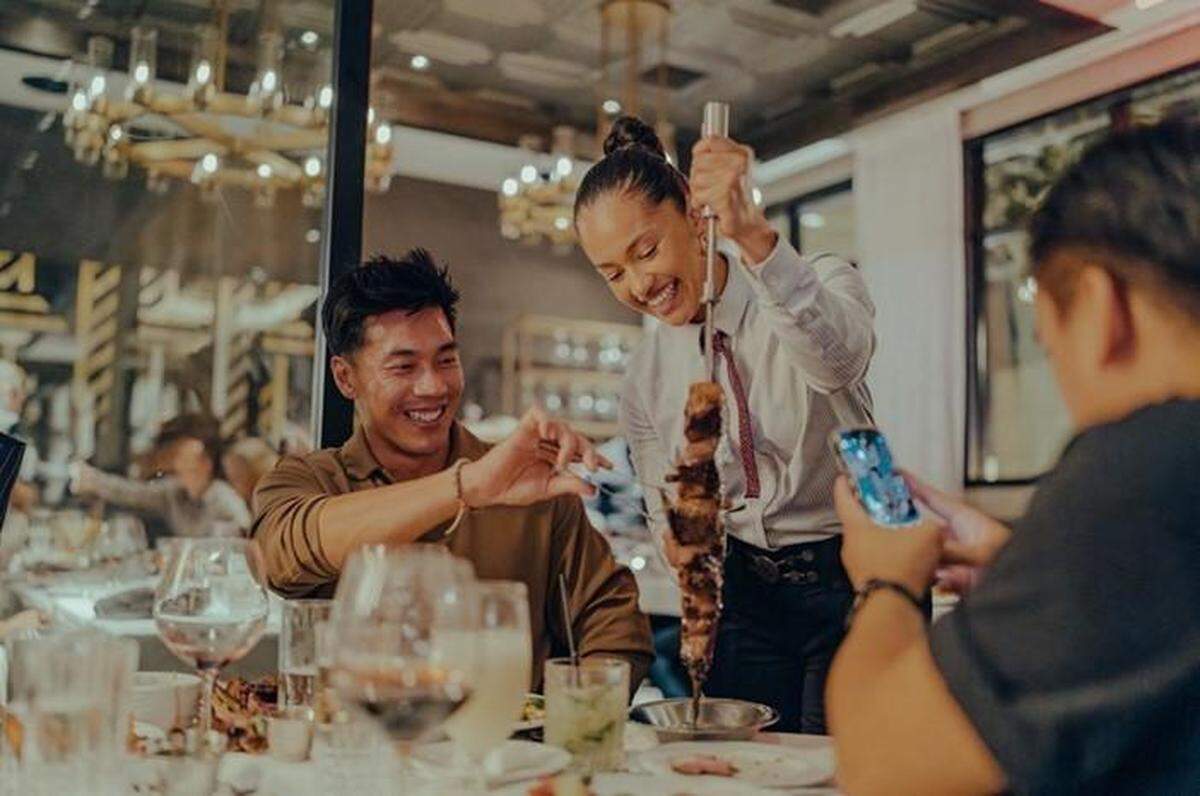 The Full Churrasco Experience at Fogo de Chao offers a fixed-price menu that includes premium and classic cuts of meat, plus side dishes and the Market Table.