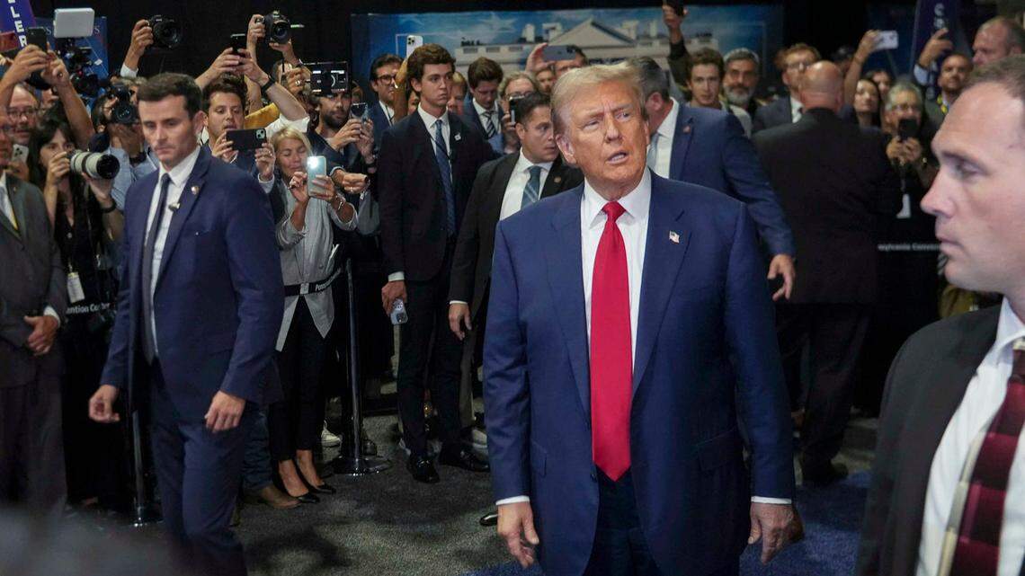 Former President Donald Trump speaks with media after the presidential debate in the spin room in Philadelphia on Sept. 10, 2024.